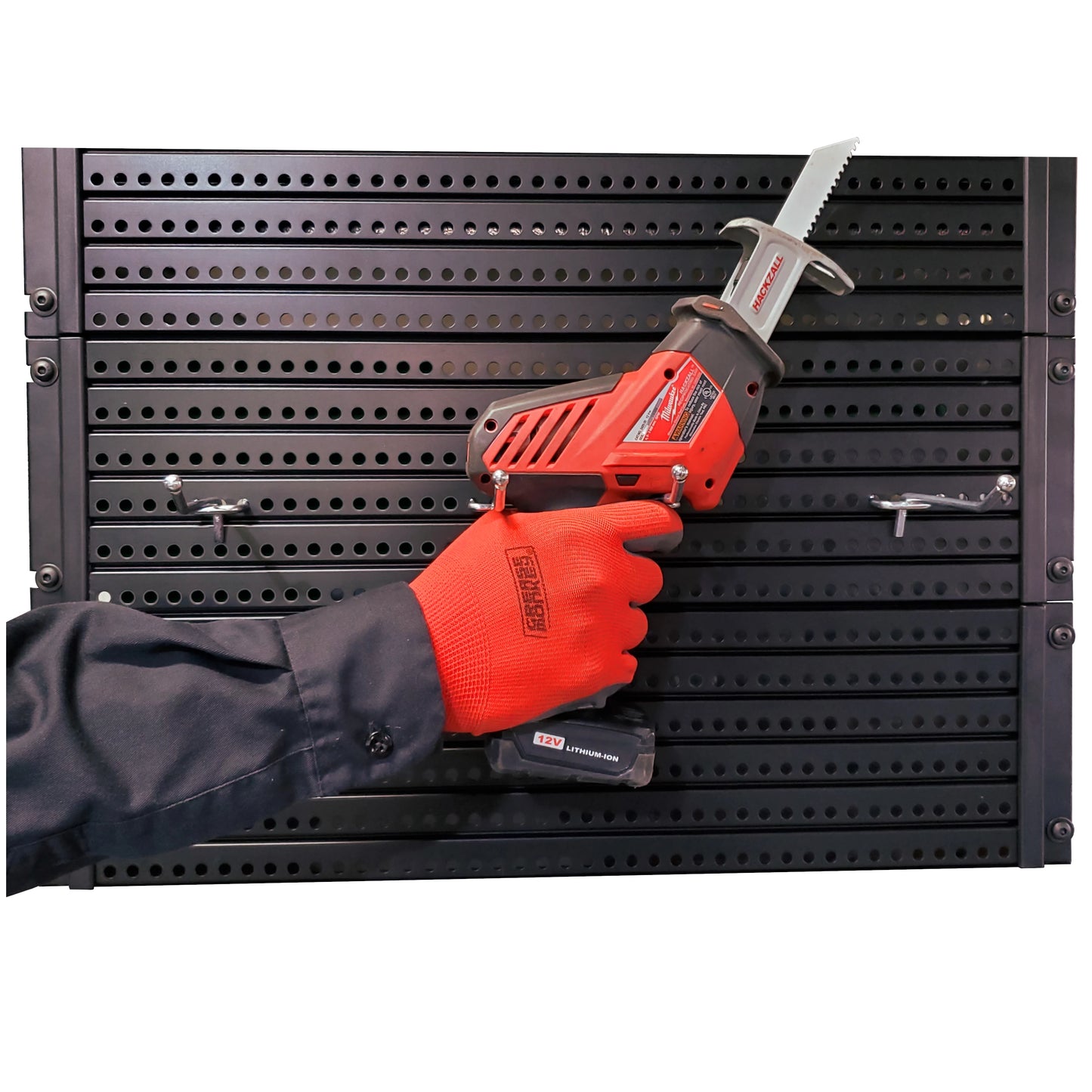 Close up image of a worker hanging a tool on a black Handypeg pegboard product.